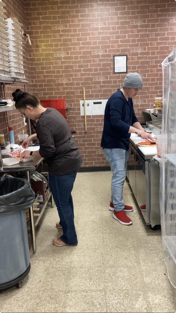 Restaurant kitchen preparing online orders